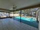 Spacious screened pool area with tile flooring and ample room for outdoor enjoyment at 1000 Godfrey Ave, Spring Hill, FL 34609