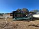 Screened in pool with an inground jacuzzi and a full enclosure at 1000 Godfrey Ave, Spring Hill, FL 34609