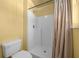 Bathroom with shower stall and beige shower curtain at 10191 Jordan St, Spring Hill, FL 34608