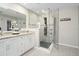 Elegant bathroom with double vanity and glass-enclosed shower at 10464 Henderson St, Spring Hill, FL 34608