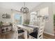 Charming dining room with a farmhouse table and stylish lighting fixture at 10464 Henderson St, Spring Hill, FL 34608