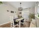 Bright dining room features a farmhouse table and chandelier at 10464 Henderson St, Spring Hill, FL 34608