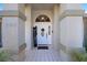 Inviting front entrance with a white door and tiled porch at 10464 Henderson St, Spring Hill, FL 34608