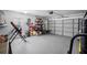 Garage with storage shelving and space for two cars at 10464 Henderson St, Spring Hill, FL 34608