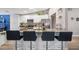 Modern kitchen with white cabinets, granite counters, and stainless steel appliances at 10464 Henderson St, Spring Hill, FL 34608