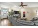 Comfortable living room with a sectional sofa and view of entryway at 10464 Henderson St, Spring Hill, FL 34608