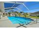 Enclosed rectangular pool with a concrete deck at 10464 Henderson St, Spring Hill, FL 34608