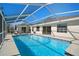 Inviting screened-in pool with ample surrounding deck space at 10464 Henderson St, Spring Hill, FL 34608