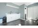 White cabinets and a small sink in the pool area at 10464 Henderson St, Spring Hill, FL 34608