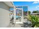Screened pool enclosure with lounge chairs at 10464 Henderson St, Spring Hill, FL 34608