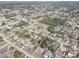 Aerial view of a residential neighborhood showing a single-Gathering home with a pool at 11463 Cavern Rd, Spring Hill, FL 34609