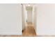 Bright hallway with light wood flooring and white walls at 11644 127Th Ave, Largo, FL 33778