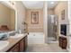 Bathroom with double vanity, garden tub, and shower at 11849 Colony Lakes Blvd, New Port Richey, FL 34654