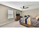 Cozy bedroom with a dresser and window with blinds at 12062 Nouveau Ave, Spring Hill, FL 34610