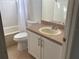 Bathroom featuring a single sink vanity and a tub-shower combo at 12336 Southbridge Ter, Hudson, FL 34669
