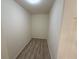 Picture of a walk-in closet with wood floors at 12336 Southbridge Ter, Hudson, FL 34669