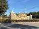 The Verandahs community entrance sign featuring stone pillars and manicured landscaping welcomes residents and visitors alike at 12336 Southbridge Ter, Hudson, FL 34669
