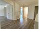 Upstairs hallway with access to bedrooms and bathrooms features modern wood flooring and neutral walls at 12336 Southbridge Ter, Hudson, FL 34669