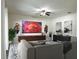 Comfortable living room featuring stylish decor, new floors, modern furnishings and ceiling fan at 12336 Southbridge Ter, Hudson, FL 34669