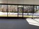 View of large screened porch with screen door leading to yard at 12336 Southbridge Ter, Hudson, FL 34669