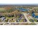 Aerial view of a residential neighborhood with lake access at 12739 Balsam Ave, Hudson, FL 34669