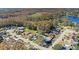 Aerial view showcasing homes and a lake in a quiet community at 12739 Balsam Ave, Hudson, FL 34669