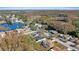 Aerial view of a neighborhood with houses near a lake at 12739 Balsam Ave, Hudson, FL 34669