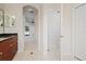 Spacious bathroom with access to bedroom and additional toilet at 12739 Balsam Ave, Hudson, FL 34669