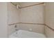 Simple bathroom with tile surround and a bathtub at 12739 Balsam Ave, Hudson, FL 34669