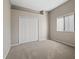 Well-lit bedroom with neutral decor and carpet flooring at 12739 Balsam Ave, Hudson, FL 34669