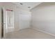 Spacious bedroom with double door closet and access to hallway at 12739 Balsam Ave, Hudson, FL 34669