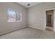Bright bedroom with a window and access to another room at 12739 Balsam Ave, Hudson, FL 34669
