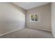 Simple bedroom with neutral walls and carpeting at 12739 Balsam Ave, Hudson, FL 34669