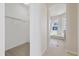 Large walk-in closet with view of bathroom at 12739 Balsam Ave, Hudson, FL 34669