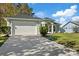 Single story house with a light green exterior and attached garage at 12739 Balsam Ave, Hudson, FL 34669