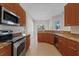 Kitchen with stainless steel appliances and granite countertops at 12739 Balsam Ave, Hudson, FL 34669