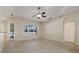 Bright living room with hardwood floors and access to the outdoors at 12739 Balsam Ave, Hudson, FL 34669