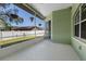 Enjoyable screened porch overlooking the backyard at 12739 Balsam Ave, Hudson, FL 34669