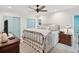 Main bedroom with light blue doors and neutral decor at 13206 Sumpter Cir, Hudson, FL 34667