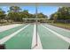 Enjoy a game of shuffleboard under covered courts at 13206 Sumpter Cir, Hudson, FL 34667