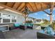 Covered patio with comfy seating, creating an inviting outdoor space at 13610 Evelane Dr, Hudson, FL 34667