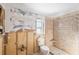 Bathroom with granite shower and toilet under renovation at 13610 Evelane Dr, Hudson, FL 34667