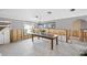 Renovation in progress, Dining room with wooden table and chandelier at 13610 Evelane Dr, Hudson, FL 34667
