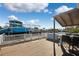Wooden deck with a view of the canal and a parked boat at 13610 Evelane Dr, Hudson, FL 34667
