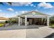 Two-car garage with the door open, showing storage and a boat at 13610 Evelane Dr, Hudson, FL 34667