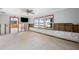 Living room undergoing renovations, features large windows at 13610 Evelane Dr, Hudson, FL 34667