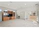 Living room with kitchen access and built-in shelving at 14072 Pullman Dr, Spring Hill, FL 34609