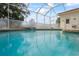 Relaxing screened pool with water feature at 14072 Pullman Dr, Spring Hill, FL 34609