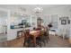 Dining room with open kitchen view and a chandelier at 305 E Liberty St, Brooksville, FL 34601