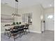 Dining area with wooden table, black chairs, and a large mirror at 3066 Hover Hall Ln, New Port Richey, FL 34655